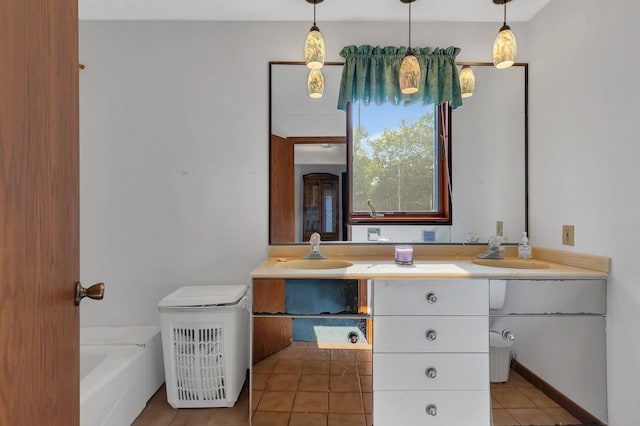 bathroom with tile patterned flooring, double vanity, and a sink