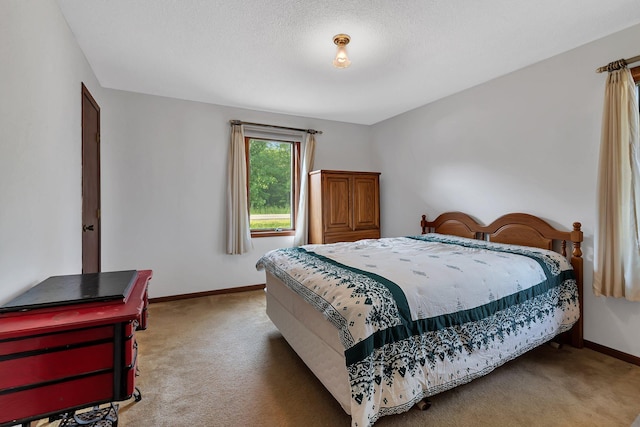 bedroom featuring light carpet and baseboards
