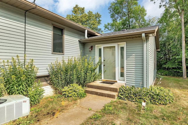 property entrance featuring central AC unit