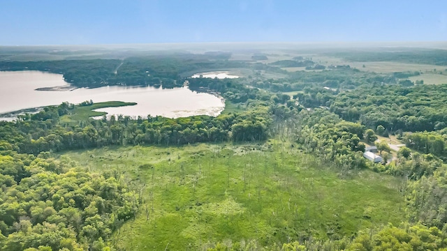 aerial view featuring a water view and a forest view