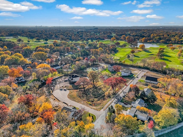 bird's eye view featuring a water view and view of golf course