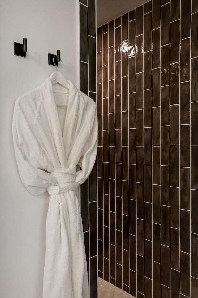 bathroom with a tile shower