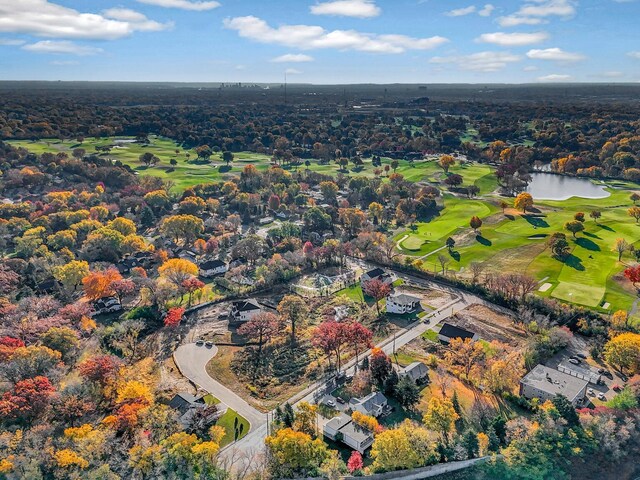 aerial view featuring view of golf course and a water view