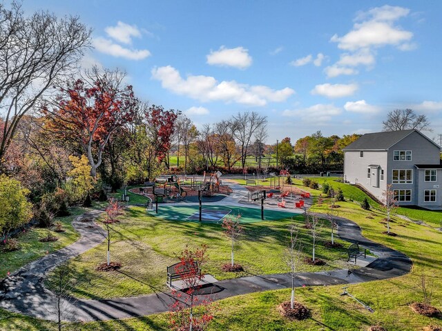 view of property's community with a lawn