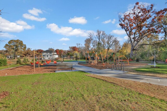 community jungle gym with a lawn