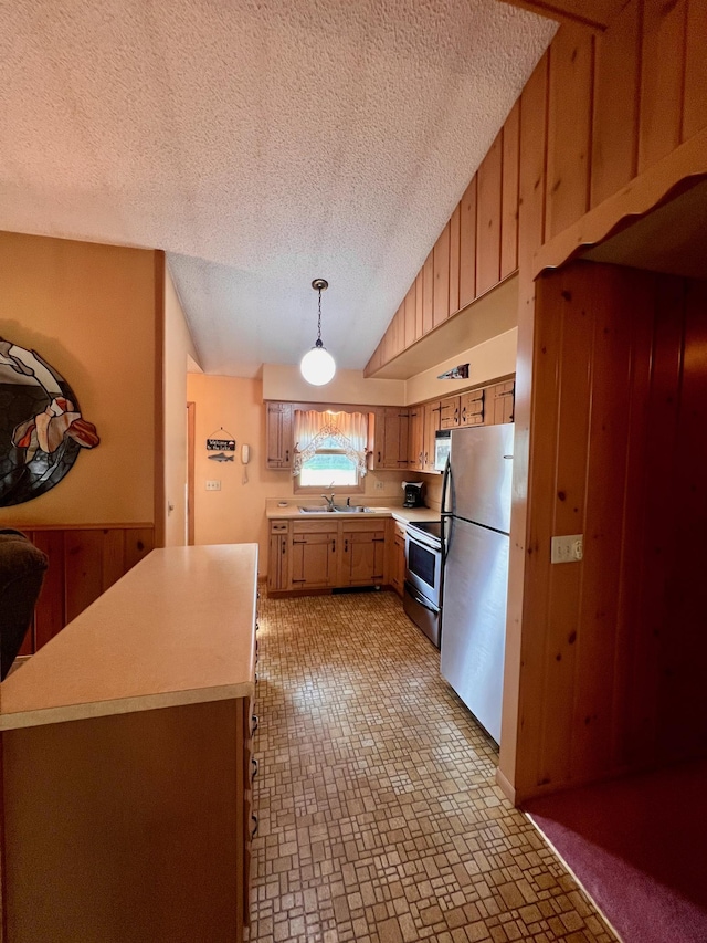 90520 Island Loop, Windemere Twp, MN 55783 - kitchen featuring wooden walls, electric range, freestanding refrigerator, light countertops, and vaulted ceiling