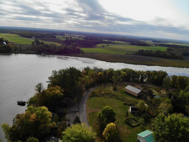 drone / aerial view featuring a water view and a rural view