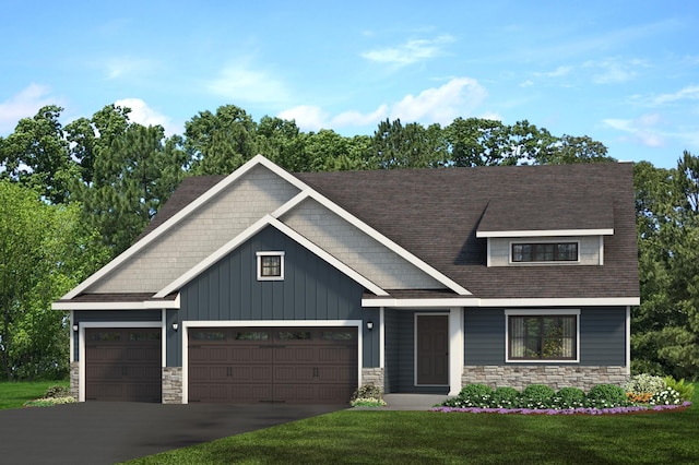 craftsman house featuring a garage and a front yard