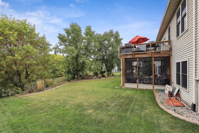 view of yard with a wooden deck and a sunroom