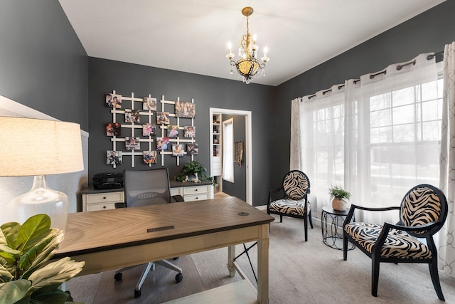 office space with a chandelier, carpet flooring, and baseboards