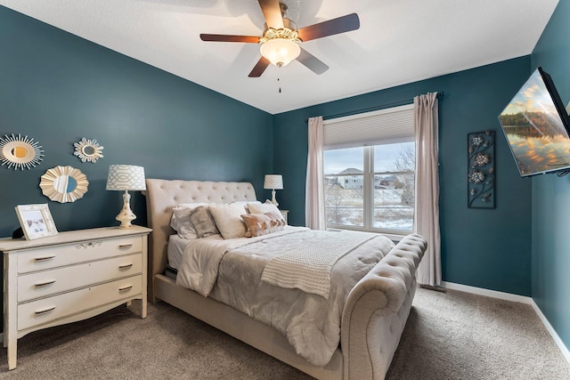 bedroom featuring ceiling fan, baseboards, and light carpet