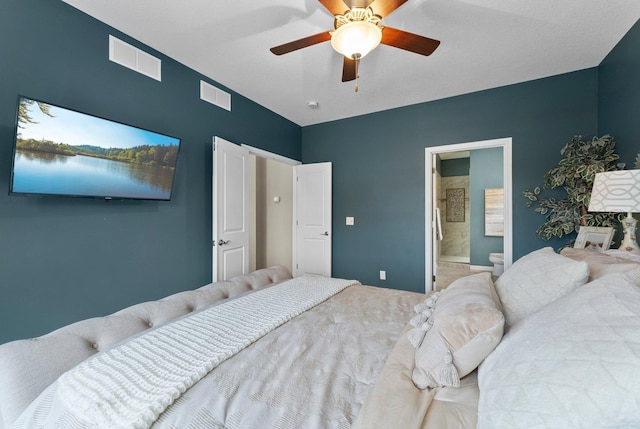 bedroom with visible vents, ensuite bath, and ceiling fan