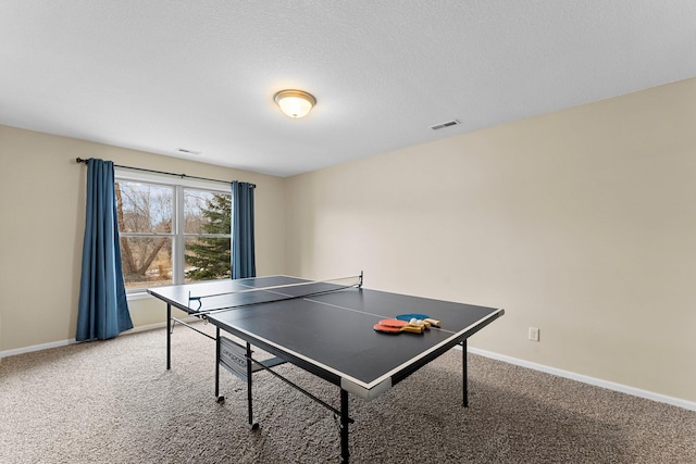 game room featuring visible vents, baseboards, and light colored carpet