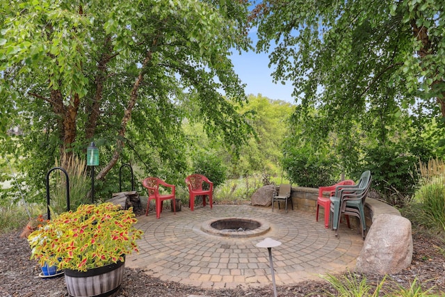 view of patio with an outdoor fire pit