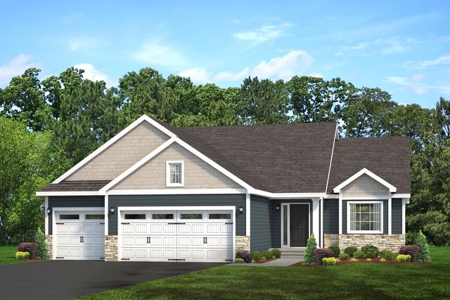 craftsman-style house featuring a garage and a front lawn