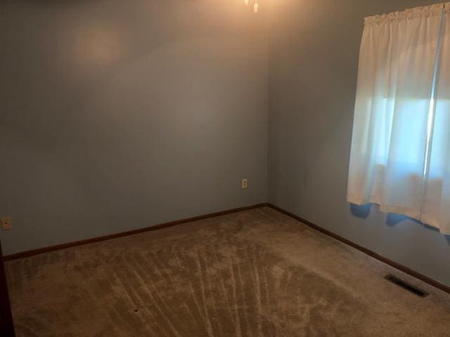 empty room featuring carpet floors