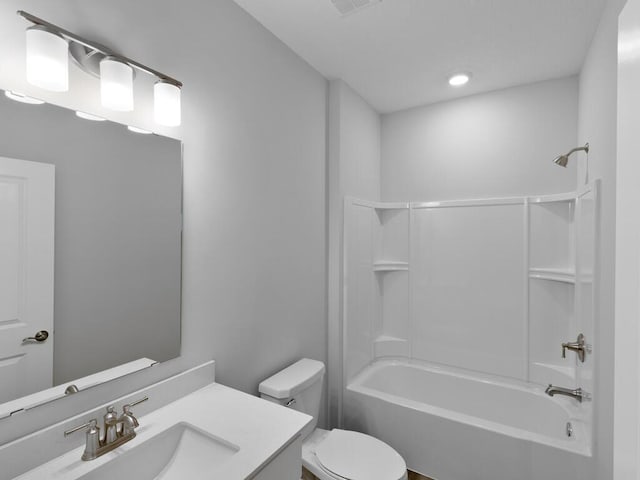 full bathroom with vanity, toilet, and  shower combination