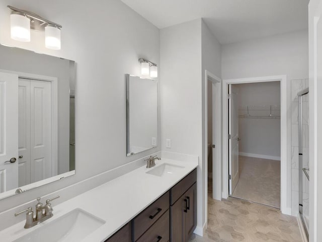 bathroom with vanity and an enclosed shower