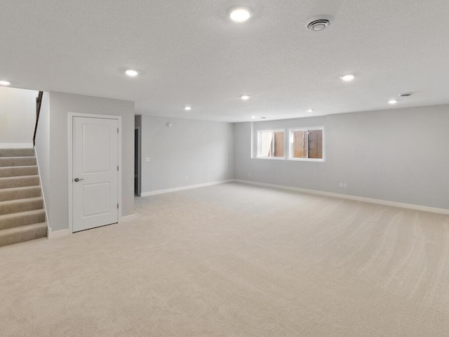 basement with light colored carpet