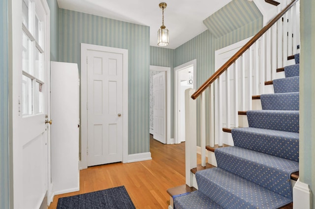 entryway with hardwood / wood-style flooring