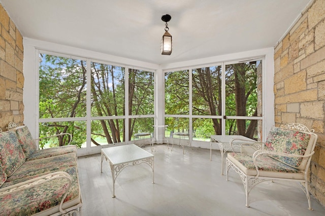 unfurnished sunroom with a wealth of natural light