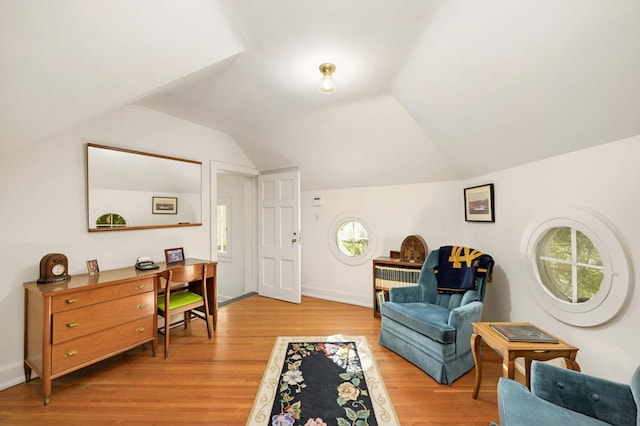 sitting room featuring light hardwood / wood-style flooring and vaulted ceiling