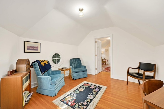 living area with lofted ceiling and light wood-type flooring