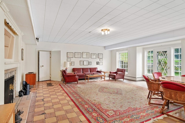 living room featuring a tile fireplace