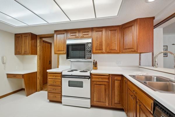 kitchen with white electric stove, black dishwasher, and sink