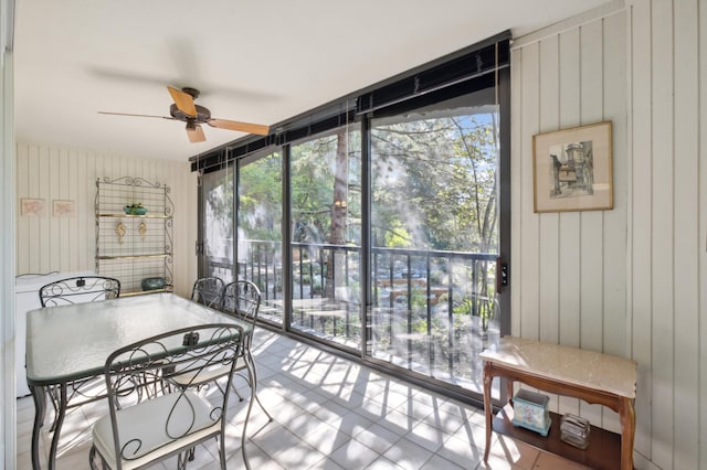 sunroom with ceiling fan and plenty of natural light