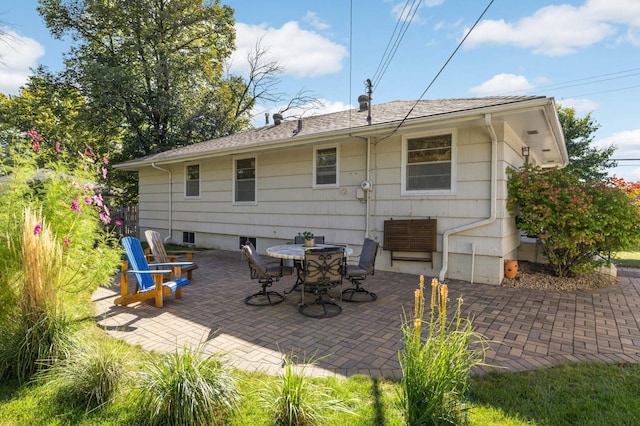 back of house with a patio