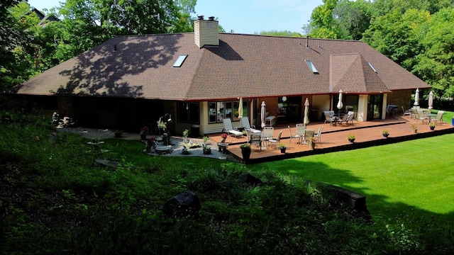 back of property with a wooden deck