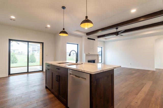 kitchen with dark wood-type flooring, plenty of natural light, pendant lighting, and dishwasher