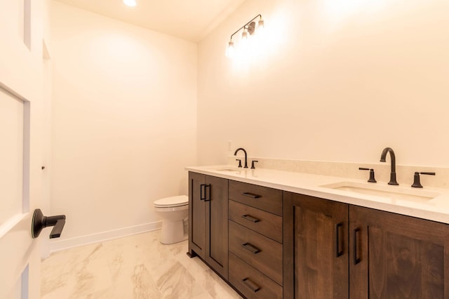 bathroom with toilet and vanity