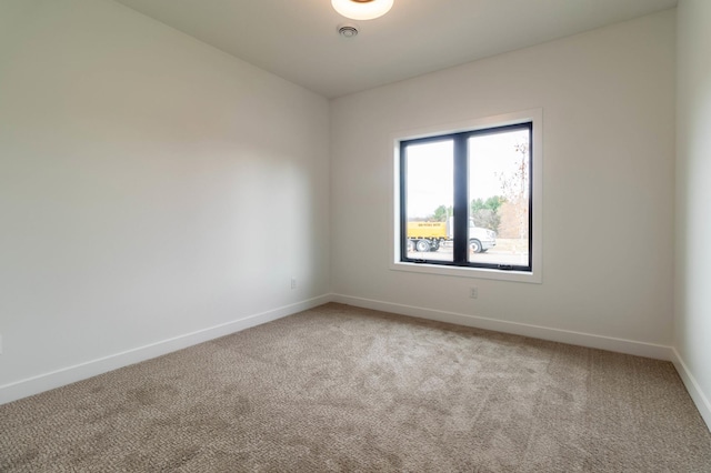 spare room featuring carpet