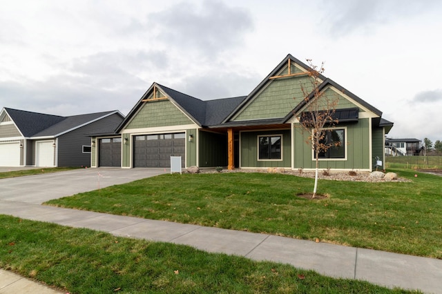 view of front of home featuring a garage and a front yard