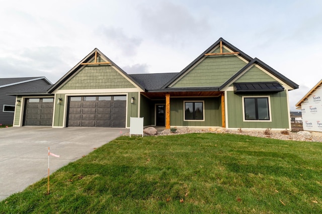 view of front of house featuring a garage and a front lawn