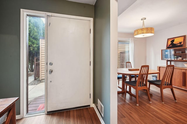 entryway with hardwood / wood-style flooring