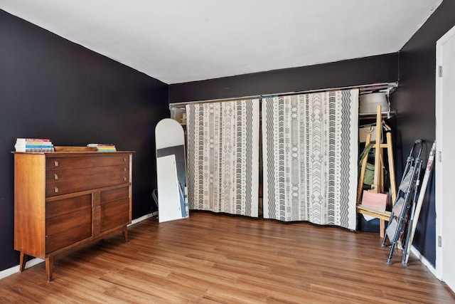 unfurnished bedroom with wood-type flooring