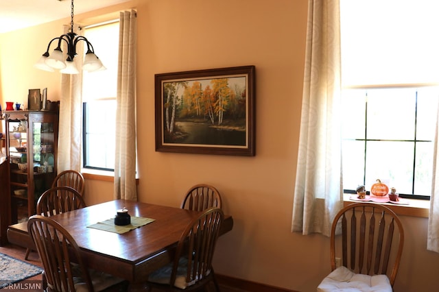 dining area featuring a notable chandelier