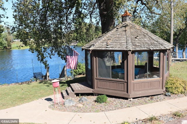 view of outbuilding with a water view and a gazebo