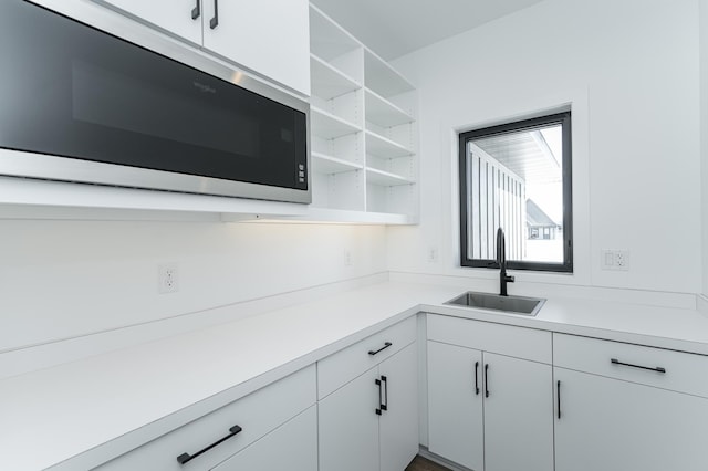 kitchen with sink and white cabinets