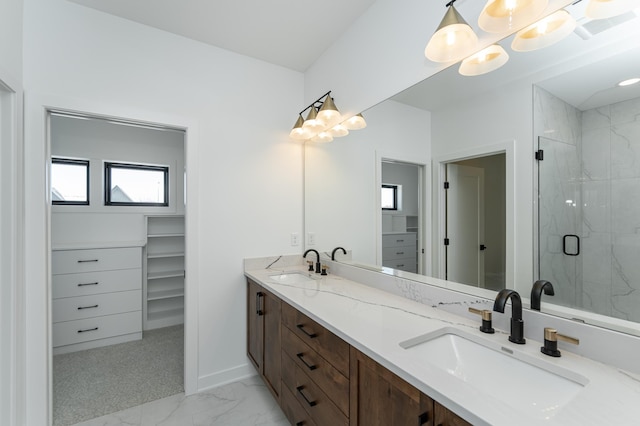 bathroom featuring vanity and an enclosed shower