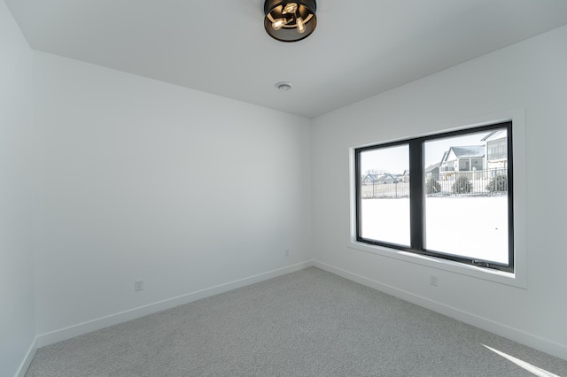 unfurnished room featuring carpet flooring