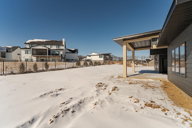 view of yard layered in snow