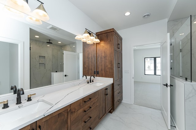full bath with marble finish floors, a marble finish shower, double vanity, recessed lighting, and baseboards