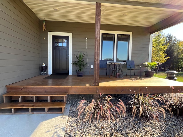 view of exterior entry with covered porch