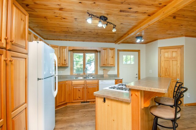 7983 County Road 127, Brainerd, MN 56401 - kitchen with white appliances, a sink, wooden ceiling, light wood-style flooring, and a center island