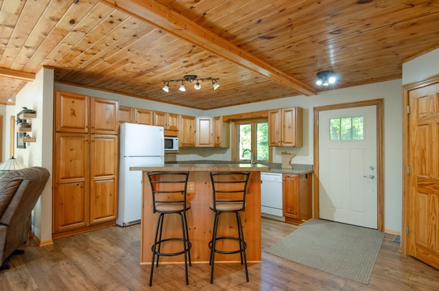 7983 County Road 127, Brainerd, MN 56401 - kitchen with white appliances, wood ceiling, a kitchen island, a sink, and a kitchen breakfast bar