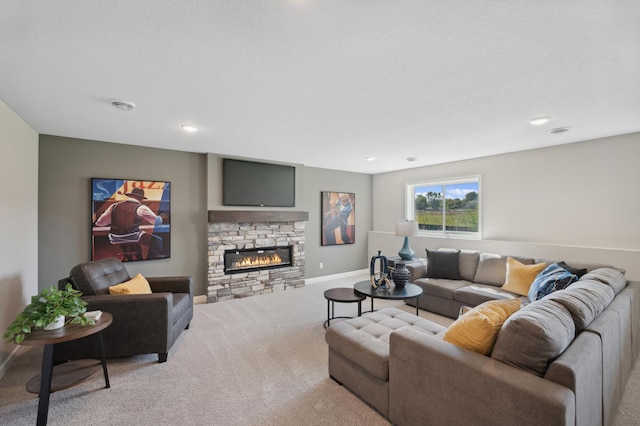 living room with light colored carpet and a fireplace